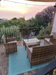 Red sunset over the sea nand coast of Forio seen from the shared outdoor lounge